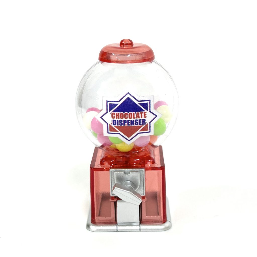 Mascotte distributeur de chocolat jouet capsule à la fraise