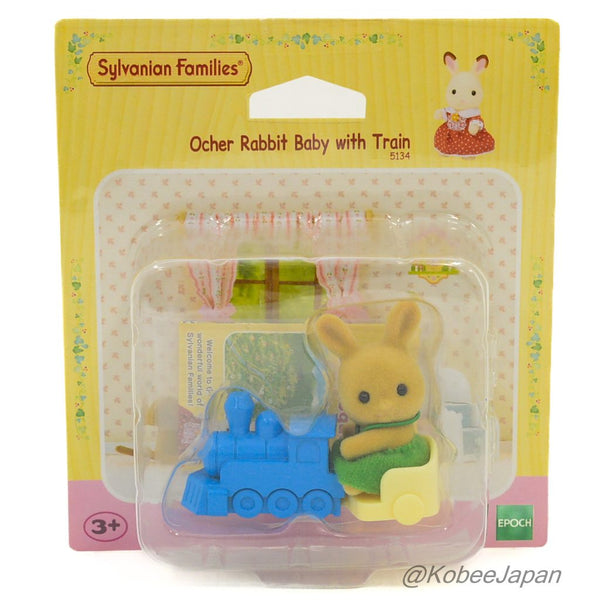 OCHER RABBIT BABY WITH T RAIN UK 5134 Sylvanian Families