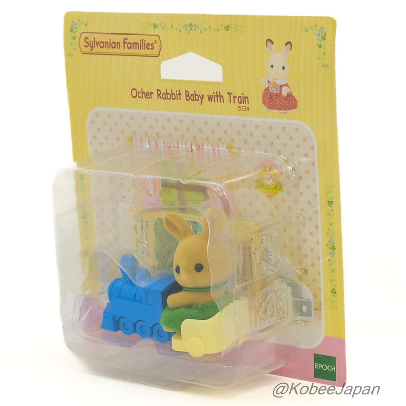 OCHER RABBIT BABY WITH T RAIN UK 5134 Sylvanian Families